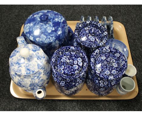 A tray of blue and white ware : three Calico Burleigh storage jars, Arthur Wood teapot, ironstone cheese dish and cover etc 