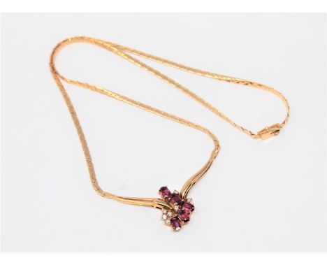 A fine quality 18ct gold ruby and diamond necklace, 12.4g.