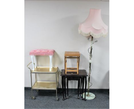 A nest of three inlaid mahogany tables, folding stool, dressing table stool, gilt two tier trolley and brass and onyx standar