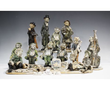 Twelve Norman Underhill pottery figures, including chimney sweep, fisherman, cellist and artist, height of tallest 28cm, with