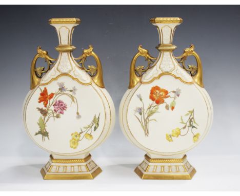 A pair of Royal Worcester porcelain Persian style vases, circa 1890, each flattened pear form body painted and gilt with flow