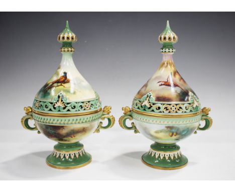 A near pair of Hadleys Royal Worcester porcelain potpourri jars, pierced covers and inner liners, circa 1915, one painted by 
