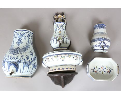 A French faience water fountain or cistern (lavabo), 19th century, the baluster shaped reservoir painted with flowers and fol
