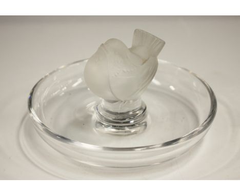 A Lalique Pinson frosted and clear glass cendrier trinket dish, late 20th century, modelled with a bird to the centre of a ci