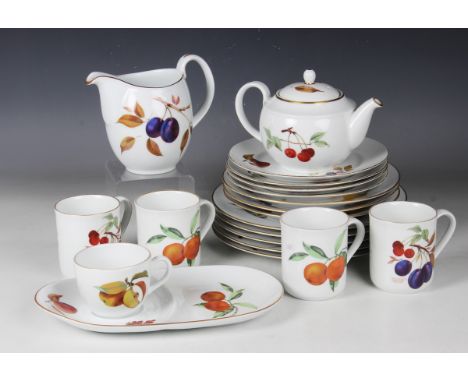 A collection of Royal Worcester Evesham pattern tablewares, including four teacups and saucers, four coffee mugs, a teapot an