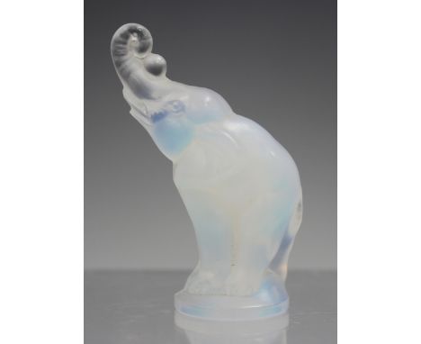 A small Art Deco Sabino opalescent glass model of an elephant, 1930s, with raised trunk, engraved 'Sabino Paris' to base, hei
