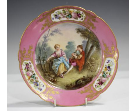 A pink ground Sèvres style cabinet plate, late 19th century, painted with a courting couple, signed Bouchen, within the gilt 