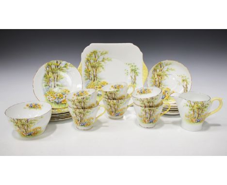 A Shelley Daffodil Time part tea service, comprising square plate, six teacups and saucers, six tea plates, milk jug and suga