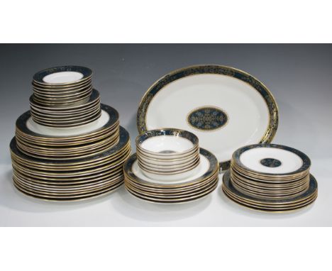 A Royal Doulton Carlyle pattern part service, comprising an oval platter, seven soup plates, eight cereal bowls, thirteen din