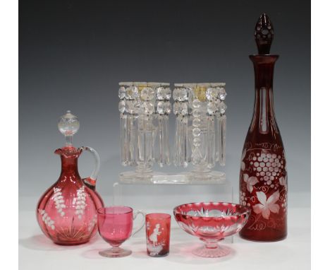 A pair of clear cut glass lustres, 19th century, the octagonal tapered stems between foliate cut rims and feet, hung with pri