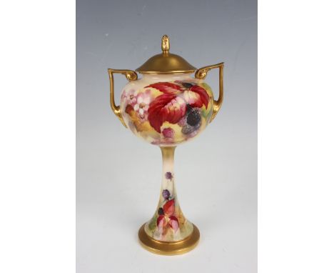 A Royal Worcester two-handled long-stemmed vase and cover, dated 1929, painted by Kitty Blake, signed, with leaves, berries a