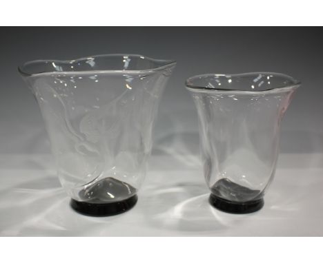 An Orrefors glass vase, dated 1936, designed by Simon Gate, the clear flared wrythen moulded body raised on a small circular 