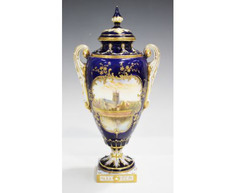 A Royal Worcester porcelain two-handled vase and cover, circa 1906, painted by Raymond Rushton, signed, with a view of Worces