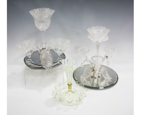 A mirrored base glass epergne, late 19th century, designed as a central stemmed bowl engraved with flowers and foliage beneat