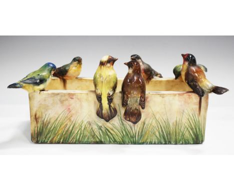 A Jerome Massier Vallauris majolica planter, late 19th/early 20th century, of rectangular shape, painted with grasses, the ri