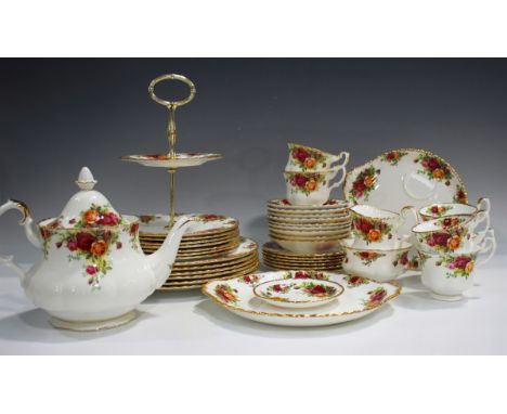 A Royal Albert Old Country Roses pattern part service, comprising teapot and cover, two-tier cake stand, six teacups and nine