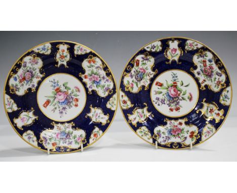 A pair of Barr, Flight &amp; Barr Worcester plates, 1804-13, painted with a central floral panel against a blue scale ground 