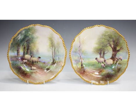 A pair of Royal Worcester porcelain cabinet plates, circa 1928, painted by Harry Davis, each with a scene of sheep and lambs 