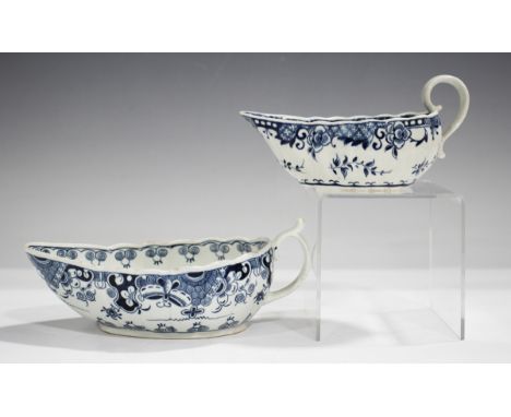Two Worcester sauceboats, circa 1775-80, both of shallow fluted form, the first in the Full Moon pattern with high scroll han