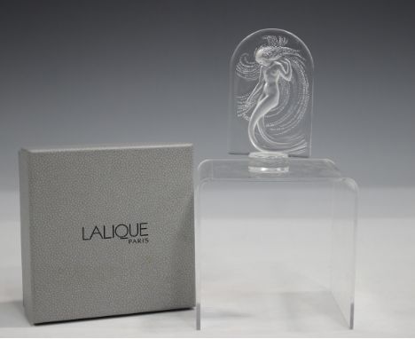 A Lalique Naiade paperweight, late 20th century, designed as a frosted figure in an arched panel, raised on a small circular 