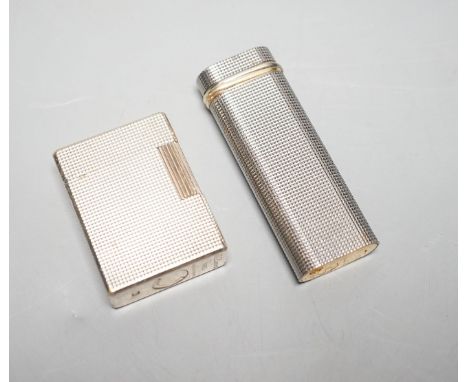 A Cartier engine turned lighter and a similar cased Dupont lighter
