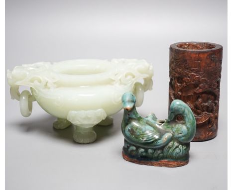 A Chinese bowenite jade tripod censer, 17cm wide, a Chinese green glazed ‘duck’ water dropper and a small bamboo brush part, 