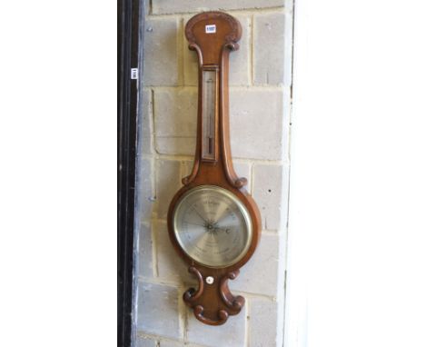 A Victorian oak cased wheel barometer and thermometer by E. Setti, Brooke Street, London, height 102cm