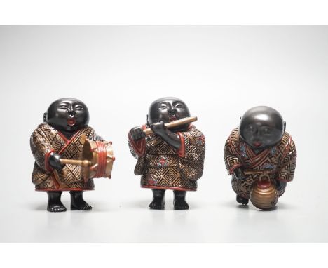 A set of three Japanese lacquered composition ‘musician’ netsuke, 6.5cm