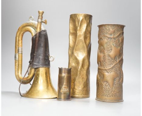 Three WWI brass trench art shell cases and a Couesnon &amp; Cie brass bugle