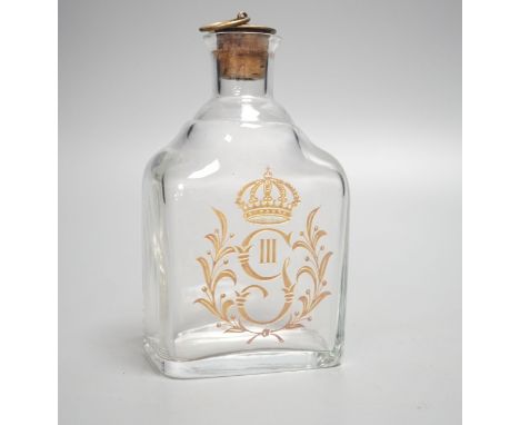 A 19th century crested glass decanter 17cm