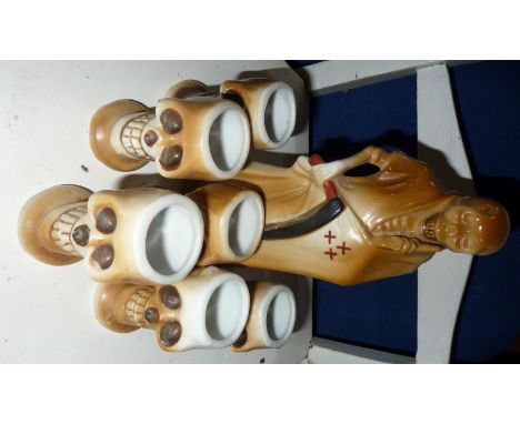 Japanese 'Poison Decanter' and six skull shaped shot glasses  