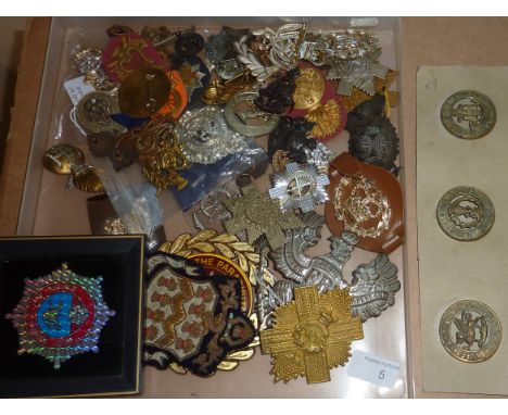 Selection of military badges including The Royal Highlanders, The Royal Scots, The Royal Army Ordnance Corp etc.