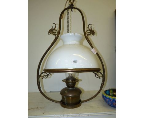 A brass hanging Lamp, (shade badly damaged), 29'' high x 18'' wide.