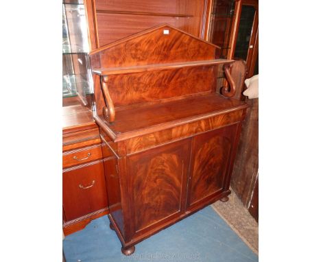 A circa 1900 Mahogany Chiffonier having an upstand with scroll supports to the shelf, a full width frieze drawer and opposing