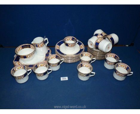 A Gladstone china part Teaset in Imari style pattern including twelve cups and saucers, twelve plates, two bread and butter p