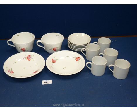 Two pretty hand painted breakfast cups and saucers and six white porcelain coffee cans and saucers.