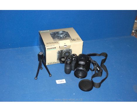 A Boxed Fujifilm Finepix S2980 14 Mega Pixel Digital Camera with Manual, Cables, Strap and Mini Tripod.