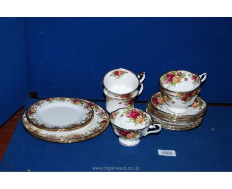 A quantity of Royal Albert Old Country Roses to include three mugs, two cups, six saucers and four plates in Old Country Rose