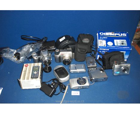 A quantity of Digital Cameras including a Canon Digital Ixus 40, a Minolta Dimage Z1, a Canon Digital Ixus 970 IS, an Olympus