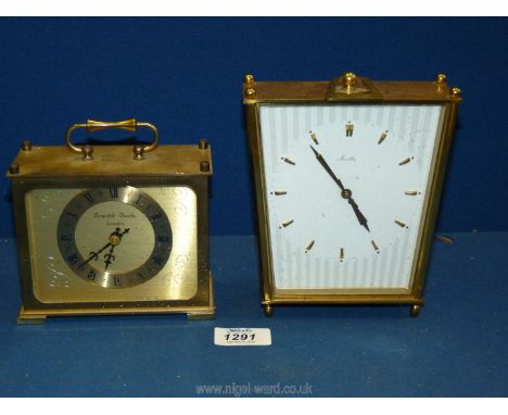 A Brass Eurastyle quartz clock 5 1/4" x 2 1/2" deep x 4 1/2" tall with a Mantle clock made in Germany 5 1/2" x 2 deep x 6 1/2