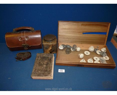 A shallow wooden box, quantity of ceramic and metal door knobs, tea caddy and small leather handbag.