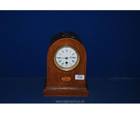 An elegant Bracket/mantel Clock having a single train movement, the white face with Roman hour numerals and Arabic minutes, w