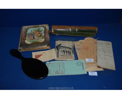 A Victorian album of black &amp; white portrait photos, black &amp; white postcards of Europe and some ephemera and a mirror.