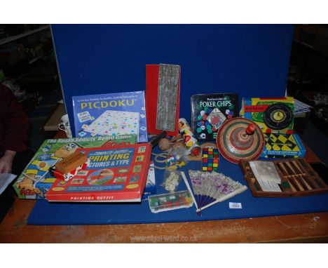 A box of vintage toys and games including Roulette, spinning top,skipping rope, backgammon etc.