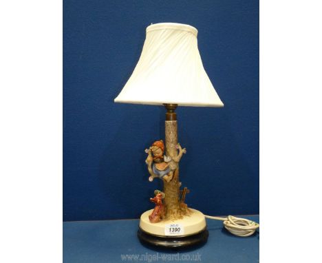 A Hummel lamp of children climbing a tree 'Out of Danger', marked 44B, 13'' tall excluding shade [Running at the time of lott