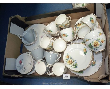 A Duchess yellow rose part Teaset including twelve cups, saucers and plates, two bowls, jug and bread and butter plate togeth