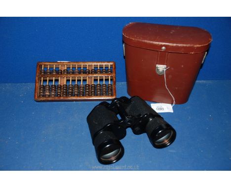 A pair of Carl Zeiss 10 x 50 binoculars in a leather case, plus an Abacus/counting frame.