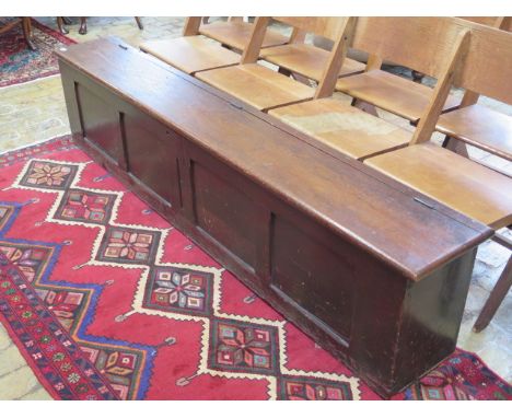 A pitch pine hall bench with lift up top and panelled front, 48cm tall x 213cm x 31cm 