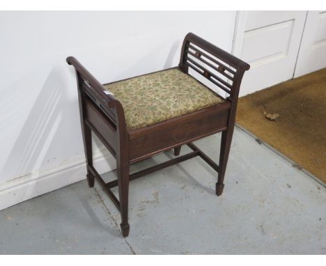 An Edwardian inlaid mahogany music stool 