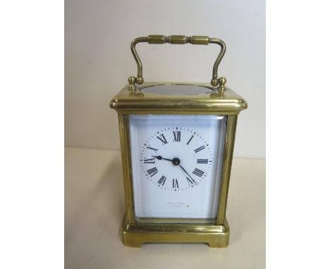 A French 8 day carriage clock, working, 12.5cm tall, small chips to front glass 